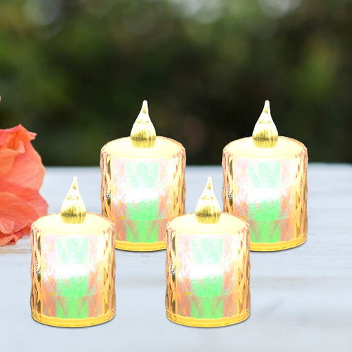 A set of four flickering flameless LED candles arranged on a surface, ideal for home decor.