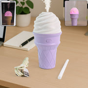 Purple ice cream cone humidifier with LED light on a desk