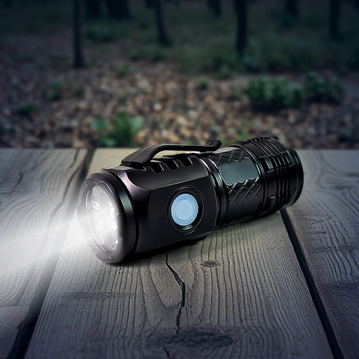 Compact rechargeable LED torch illuminating a dark area.