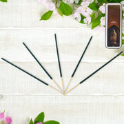 Handcrafted bundle of fragrant incense sticks, emphasizing their natural flower petal composition.