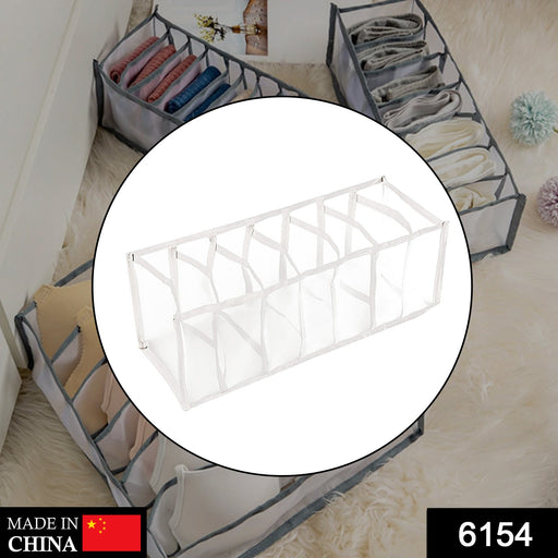Close-up of the multi-compartment laundry organizer, showing its practical design.