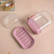 Plastic soap dish with transparent dust-proof lid and pink base showing multipurpose design