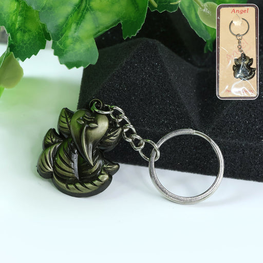 Front view of Ganesh Face Antique Black Metal Keychain showing detailed Ganesh design