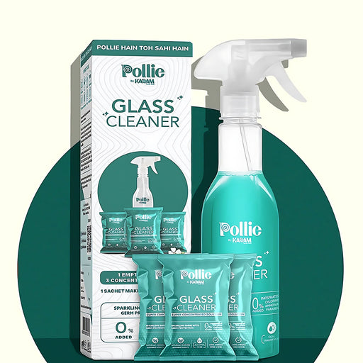 Concentrated glass cleaner refill sachets and reusable spray bottle on a white background.