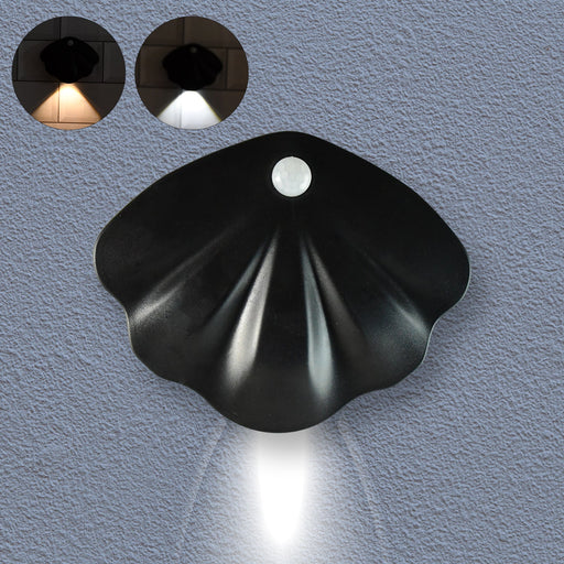 Shell-shaped motion sensor night light emitting soft glow