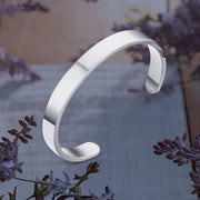 Minimalist silver-tone stainless steel bracelet with open-ended design