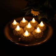 Set of 8 lotus shaped LED flameless tealight candles with warm white glow