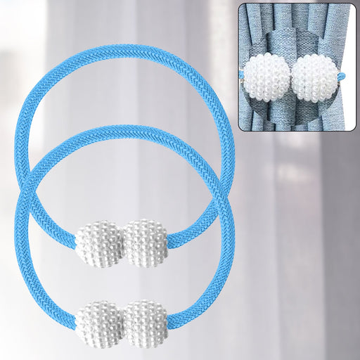 Magnetic curtain tieback with elegant pearl holding a white curtain
