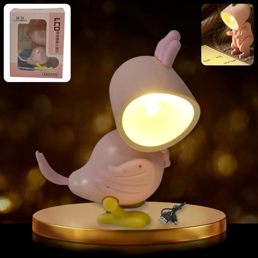 Magnetic Parrot Night Lamp glowing on a bedside table.