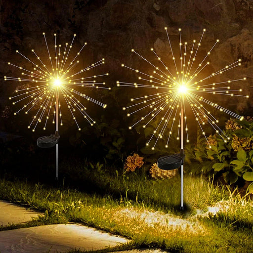 Decorative solar firework LED garden lights illuminating outdoor space