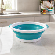 Foldable collapsible utility basket with handles in a home setting