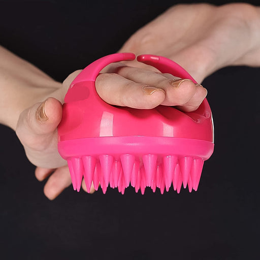 Hand holding a soft silicone Scalp Massager Comb for daily use.