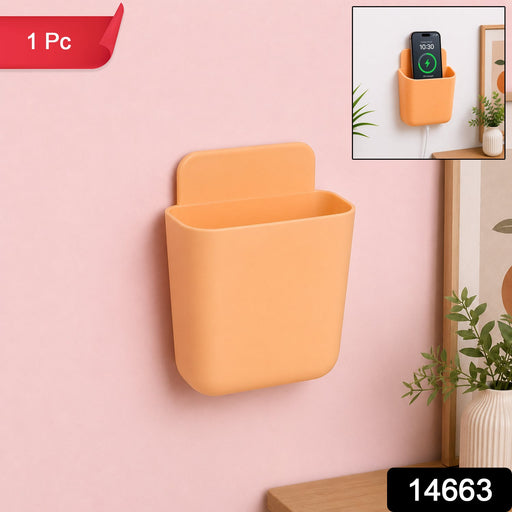Close-up view of plastic wall mounted storage pocket with keys and phone