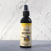 Beeswax Furniture Polish spray bottle highlighting natural ingredients for wood and leather care.