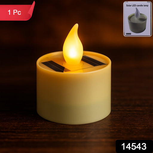 Close-up of solar powered LED candle showing solar panel and LED flame effect