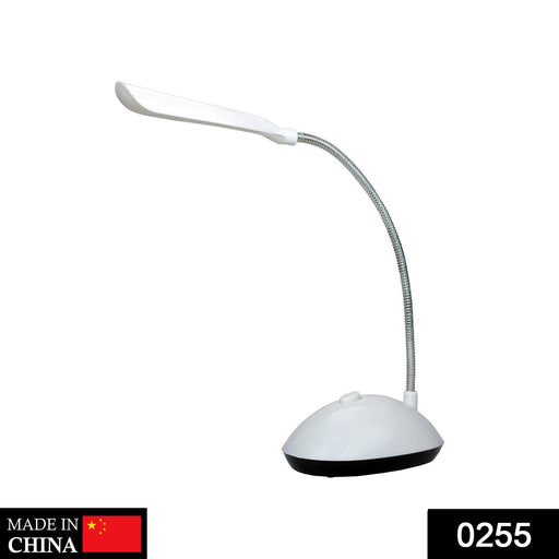 Dimmable portable LED reading light on a study desk.