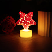 Single star shape decorative LED tealight candle showing battery base