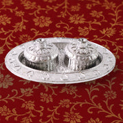 Oval kumkum holder on decorative puja thali