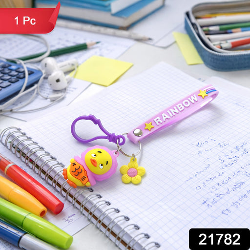 Close-up of cartoon duck keychain showing colorful rainbow silicone strap and duck charm