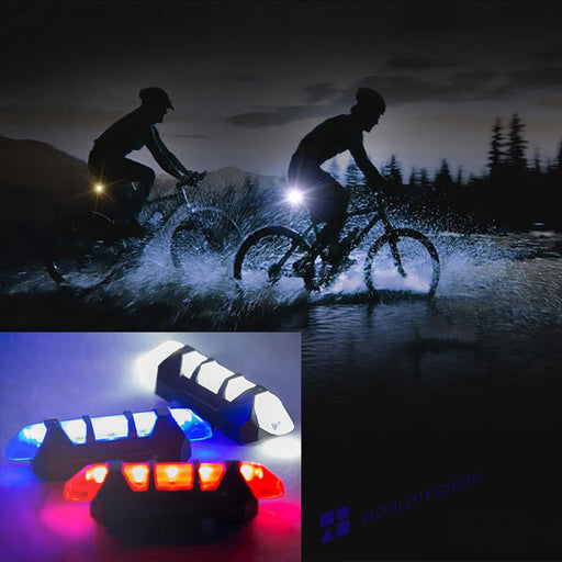Close-up of a blue rechargeable bicycle front light mounted on handlebars, showing its sleek design.