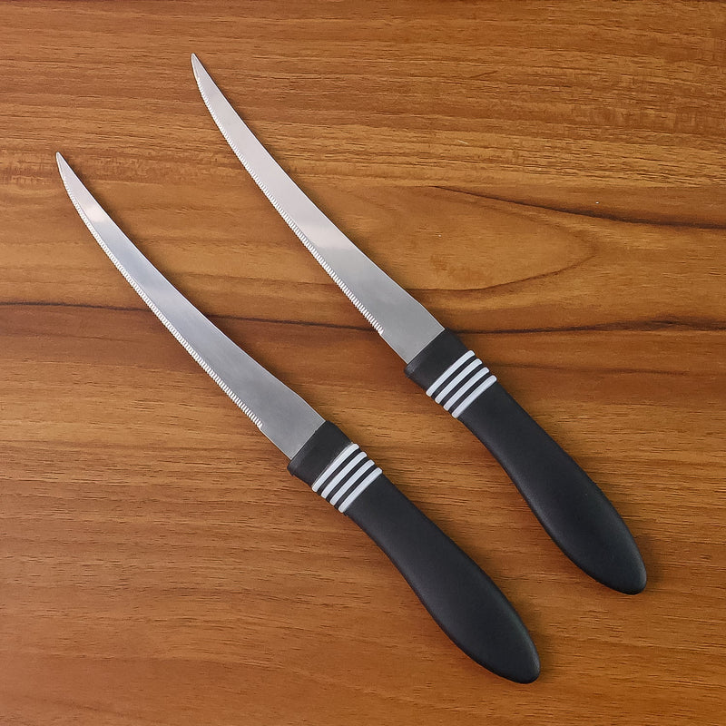 Ergonomic black ABS handle of serrated kitchen knife for comfortable grip