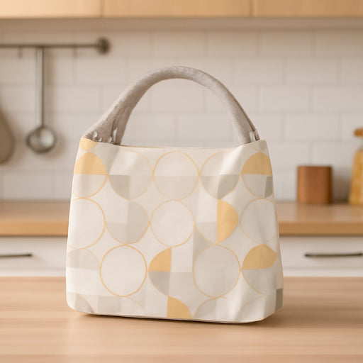 Front view of the Lunchie Bunchie insulated lunch bag, showcasing its secure zip closure.