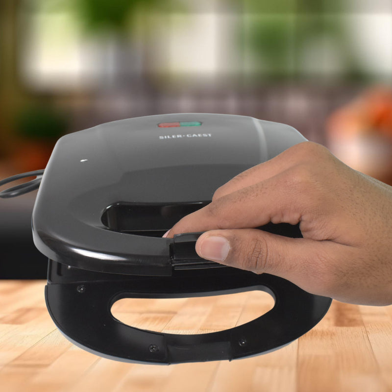 Angled view of the Sandwich Maker, highlighting the power and ready indicator lights.