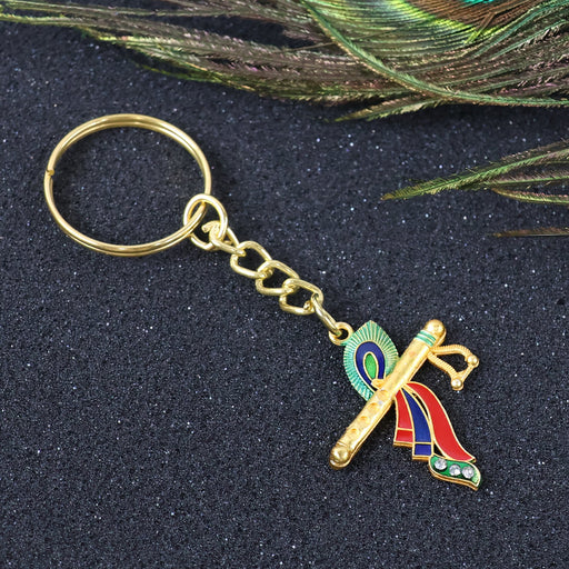 Krishna flute metal keychain with peacock feather design showing intricate details