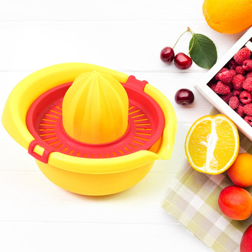Orange Hand Press Juicer with a fresh cut orange, ready for squeezing.