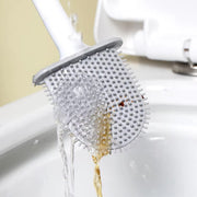 Silicone toilet brush with holder mounted on a clean bathroom wall.