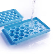 Hand pouring liquid candy mixture into the ChefAura Lollipop Candy Maker.