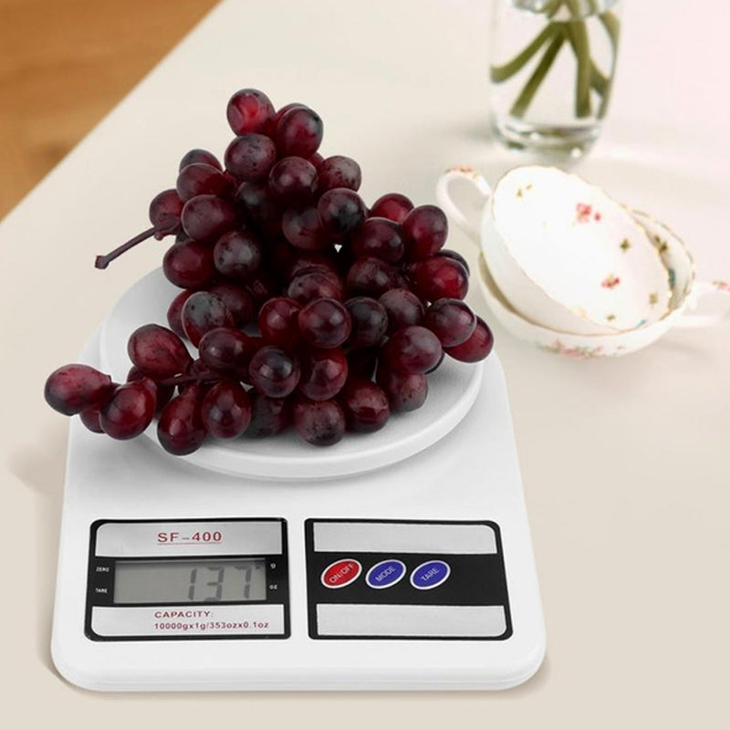 Precision digital kitchen scale featuring the tare function button.