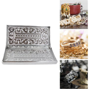 Close-up of silver embossed multipurpose cash box edges and ornamental details