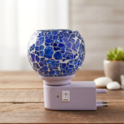 Mosaic glass night lamp emitting warm decorative glow