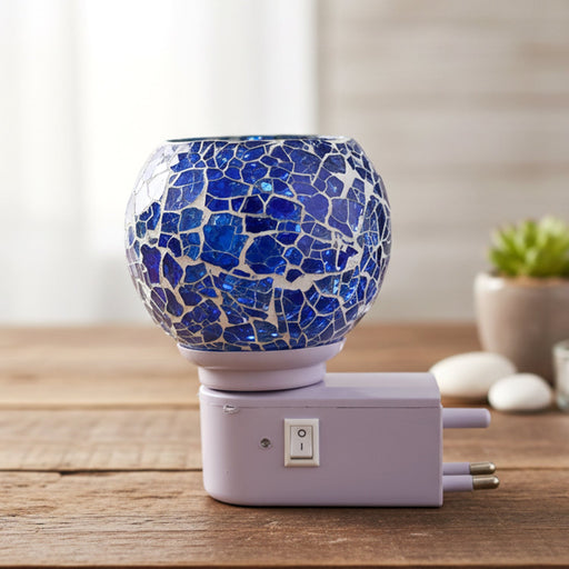 Mosaic glass night lamp emitting warm decorative glow