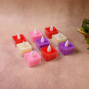 Close-up of multicolor square LED tealight candle showing flickering flame effect