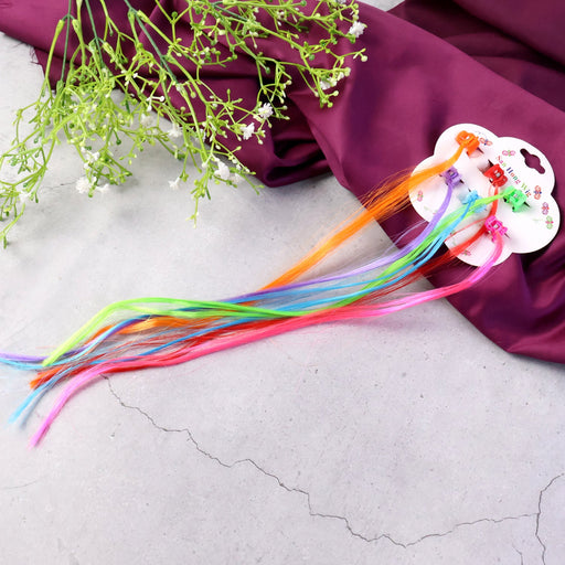 Colorful kids hair extensions with mini claw clips arranged in a set