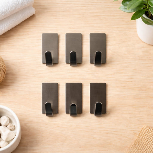 Single self adhesive wall hook on white background