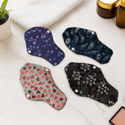 Set of reusable cloth sanitary pads in assorted prints providing eco-friendly menstrual protection