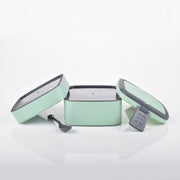 Compact green stackable lunch box, ideal for school or office.
