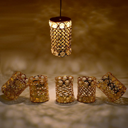 Close-up of an antique golden Jhoomer Chandelier with intricate two-line diamond patterns.