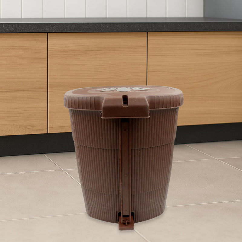 Side view of a white mini pedal dustbin, highlighting its convenient foot pedal.