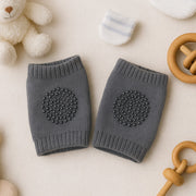 Dark grey wool knit toddler leg warmers providing knee protection