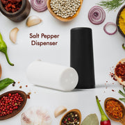 Elegant polycarbonate salt and pepper dispensers on a modern dining table.