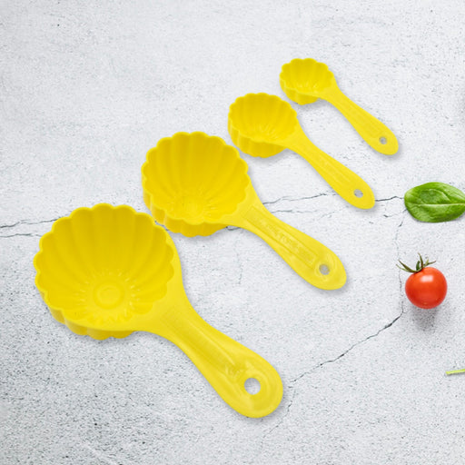 The complete set of four plastic ladoo making spoons, ideal for crafting various traditional sweets.