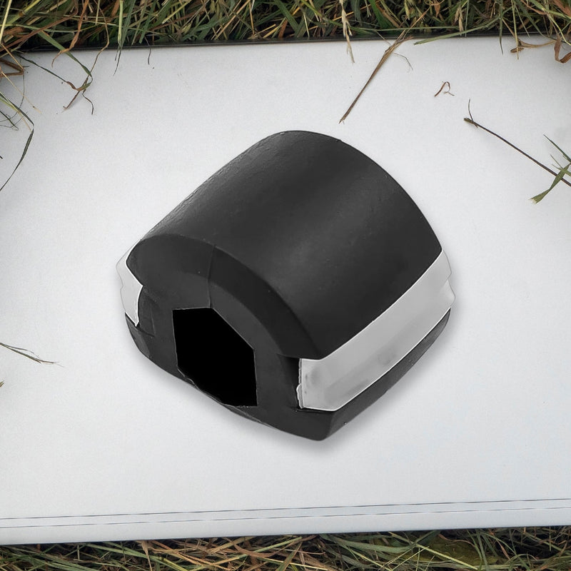 Side profile of the black Jaw Exerciser, showing its compact size.
