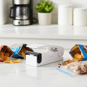 Mini heat sealer sealing a snack plastic bag securely