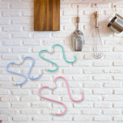 A set of six versatile S hooks metal neatly organising kitchen utensils and towels on a rail.
