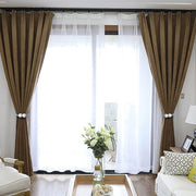 Magnetic curtain tieback twisted to adjust length on window curtain