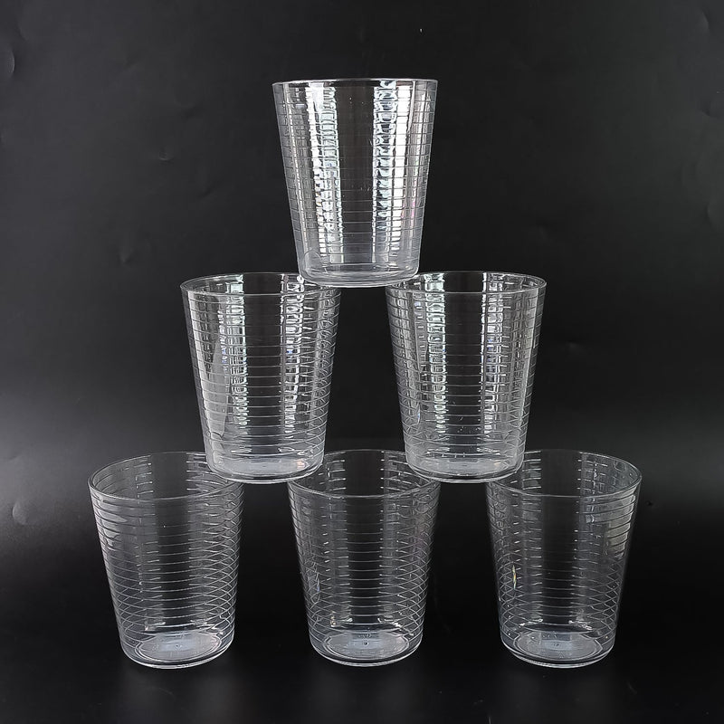 Crystal-clear Plastic Ringo Glass filled with chilled beverage on table